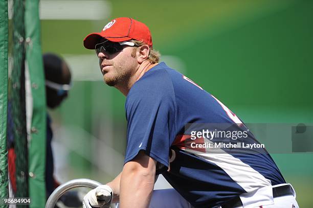 Adam Dunn of the Washington Nationals looks on during practice of a baseball game against the Colorado Rockies on April 22, 2010 at Nationals Park in...