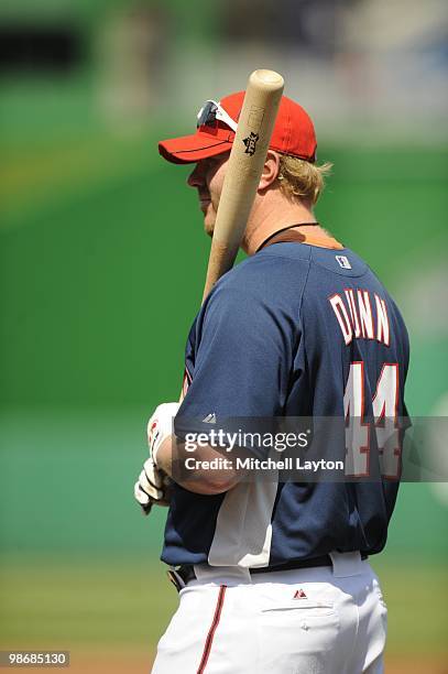 Adam Dunn of the Washington Nationals looks on during practice of a baseball game against the Colorado Rockies on April 22, 2010 at Nationals Park in...