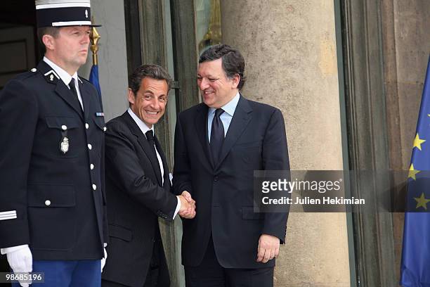 French President Nicolas Sarkozy shakes hands with European Commission President Jose Manuel Barroso after a working lunch on April 26, 2010 at the...