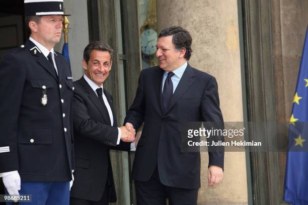 French President Nicolas Sarkozy shakes hands with European Commission President Jose Manuel Barroso after a working lunch on April 26, 2010 at the...