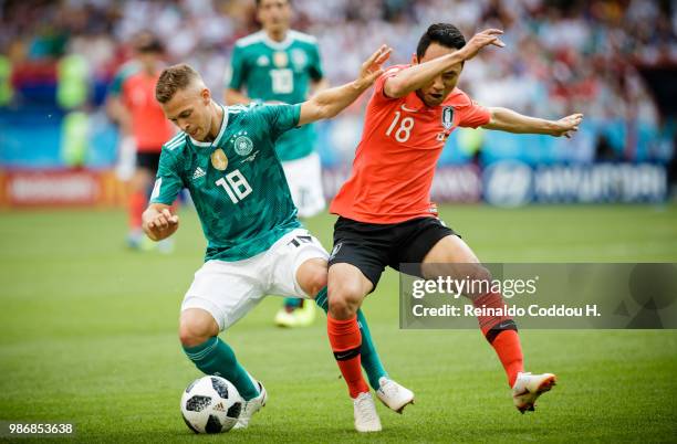 Joshua Kimmich of Germany and Seonmin Moon of South Korea fight for the ball during the 2018 FIFA World Cup Russia group F match between Korea...