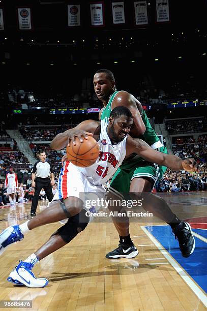 Jason Maxiell of the Detroit Pistons drives against Glen Davis of the Boston Celtics during the game on March 2, 2010 at The Palace of Auburn Hills...