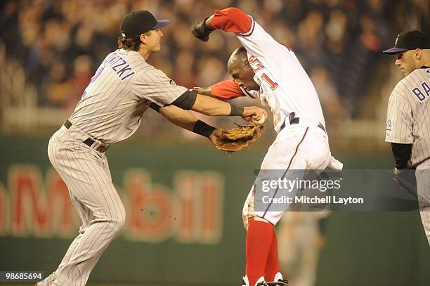 Troy Tulowitzki of the Colorado Rockies tries to tag out Nyger Morgan of the Washington Nationals during a baseball game on April 21, 2010 at...