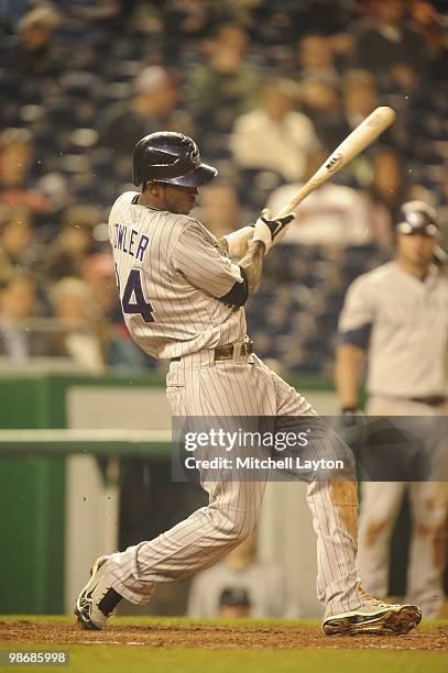 Dexter Fowler of the Colorado Rockies takes a swing during a baseball game against the Washington Nationals on April 21, 2010 at Nationals Park in...