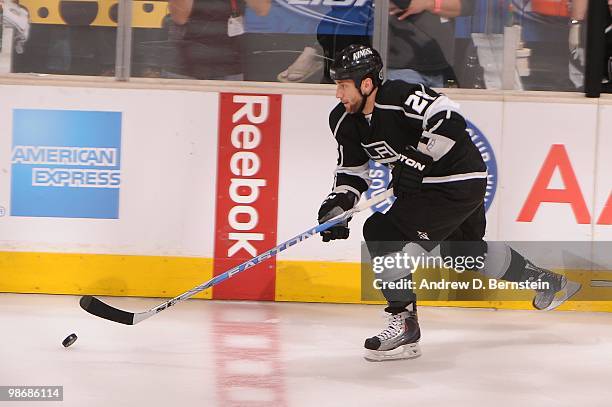 Jarret Stoll of the Los Angeles Kings skates with the puck against the Vancouver Canucks in Game Six of the Western Conference Quarterfinals during...