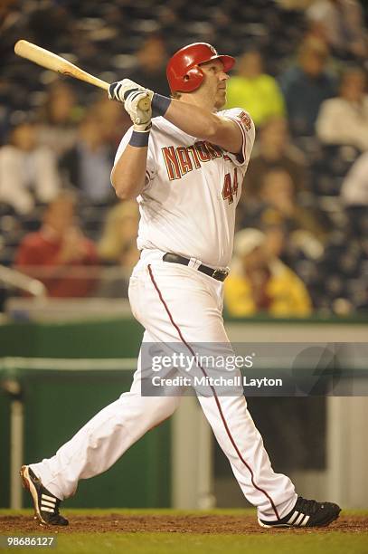 Adam Dunn of the Washington Nationals takes a swing during a baseball game against the Colorado Rockies on April 21, 2010 at Nationals Park in...