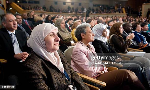 Summit participants listen as US President Barack Obama speaks at the Presidential Summit on Entrepreneurship at the Ronald Reagan Building in...