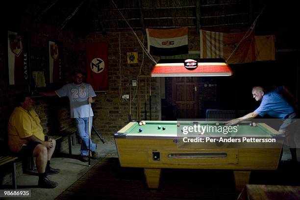 White farmers play pool in a white only members bar on March 13, 2009 in Philippolis, in the Free state province, South Africa. The village is one of...