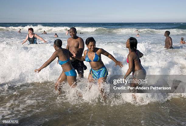 South African holidaymakers enjoy the beach in a tourist resort on July 5 at Umhlanga north of Durban, South Africa. Many South Africans visit Durban...