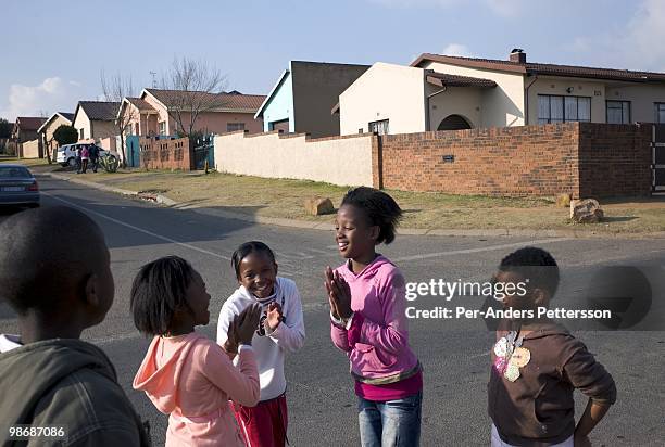 Children play in the street on July 13, 2008 in Diepkloof, a posh section of Soweto, South Africa. Soweto is the country's biggest township and the...