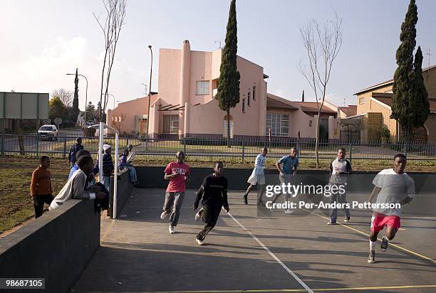 Boys play soccer on a court on July 13, 2008 in Diepkloof, a posh section of Soweto, South Africa. Soweto is the country's biggest township and the...