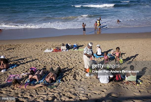 South African holidaymakers enjoy the beach in a tourist resort on July 5 at Umhlanga north of Durban, South Africa. Many South Africans visit Durban...