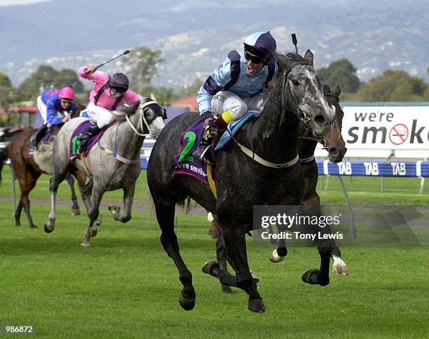 No 2 Big Pat ridden by Peter Mertens wins the Malaysia Airlines South Australian Derby from no 3 Bush Padre, at Morphettville racecourse in Adelaide,...