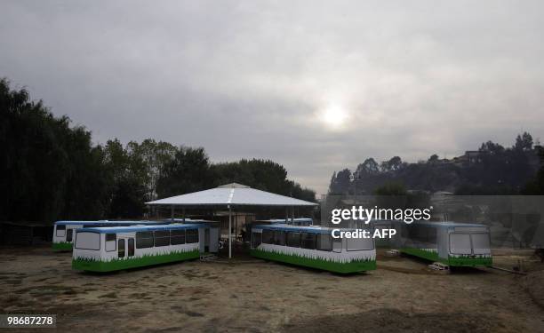 Picture taken on April 26, 2010 of the "bus school" where the private school Mis Sonidos is working following its devastation by the quake and...