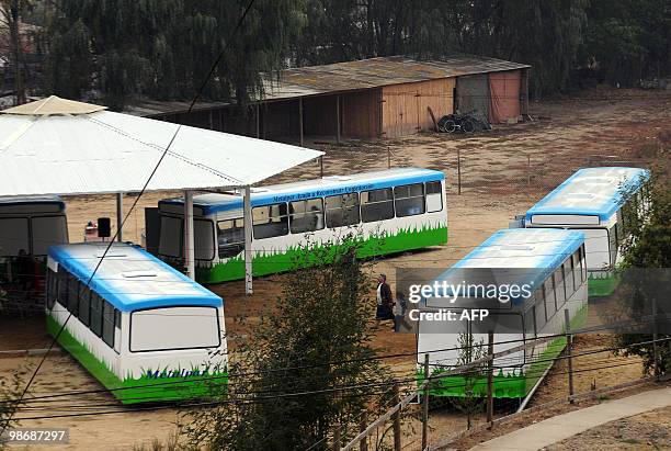 Picture taken on April 26, 2010 of the "bus school" where the private school Mis Sonidos is working following its devastation by the quake and...