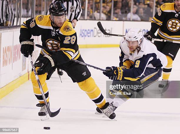 Mark Recchi of the Boston Bruins tries to keep the puck from Derek Roy of the Buffalo Sabres in Game Six of the Eastern Conference Quarterfinals...