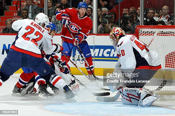 Mike Knuble of the Washington Capitals stops Scott Gomez of Montreal Canadiens from charging the net in Game Six of the Eastern Conference...