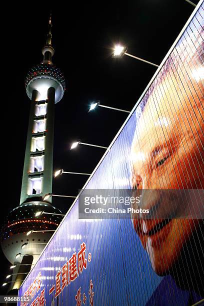 Portrait of Chinese former leader Deng Xiaoping is seen near the Oriental Pearl TV Tower on April 23, 2010 in Shanghai, China. The World Expo will be...