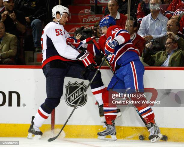 Maxim Lapierre of the Montreal Canadien body checks Jeff Schultz of the Washington Capitals in Game Six of the Eastern Conference Quarterfinals...