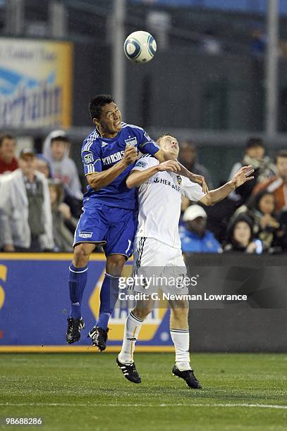 Michael Stephens of the Los Angeles Galaxy and Roger Espinoza of the Kansas City Wizards vie for a high ball during their MLS match on April 24, 2010...