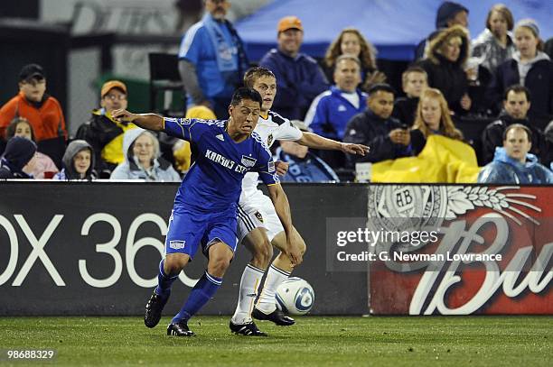 Roger Espinoza of the Kansas City Wizards and Michael Stephens of the Los Angeles Galaxy vie for the ball during their MLS match on April 24, 2010 at...