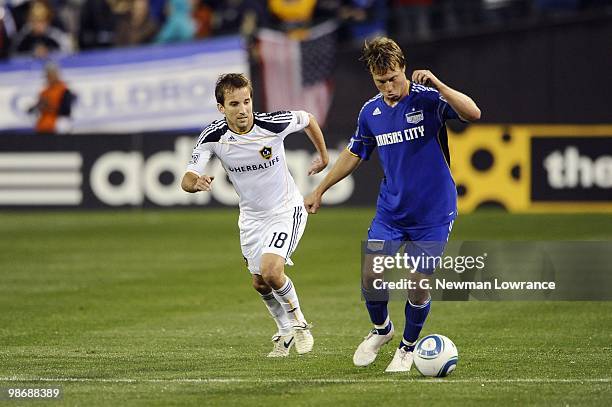 Michael Harrington of the Kansas City Wizards plays the ball under pressure from Mike Magee of the Los Angeles Galaxy during their MLS match on April...