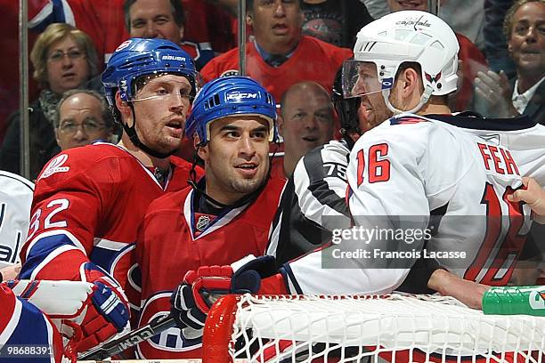 Scott Gomez of Montreal Canadiens exchanges with Eric Fehr of the Washington Capitals in Game Six of the Eastern Conference Quarterfinals during the...