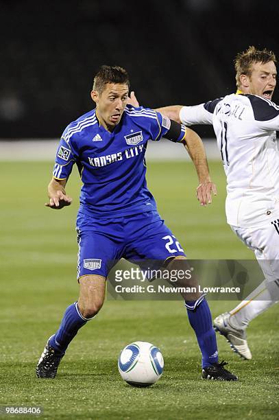 Davy Arnaud of the Kansas City Wizards under pressure from Chris Birchall of the Los Angeles Galaxy during their MLS match on April 24, 2010 at...
