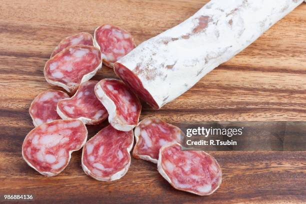 salami sausage on wooden board background - salami 個照片及圖片檔