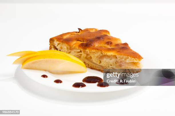 homemade apple pie on a plate with jam and apple over white background - party pies foto e immagini stock