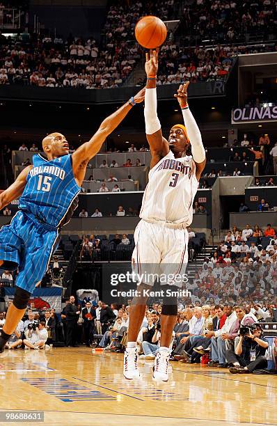 Gerald Wallace of the Charlotte Bobcats shoots over defender Vince Carter of the Orlando Magic in Game Four of the Eastern Conference Quarterfinals...