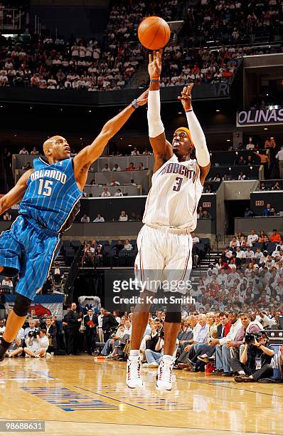 Gerald Wallace of the Charlotte Bobcats shoots over defender Vince Carter of the Orlando Magic in Game Four of the Eastern Conference Quarterfinals...