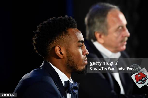 Washington Wizards President Ernie Grunfeld introduces, right, Troy Brown Jr., the team's first-round pick in the 2018 NBA Draft at a press...