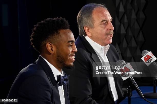 Washington Wizards President Ernie Grunfeld, right, introduces Troy Brown Jr., the team's first-round pick in the 2018 NBA Draft at a press...