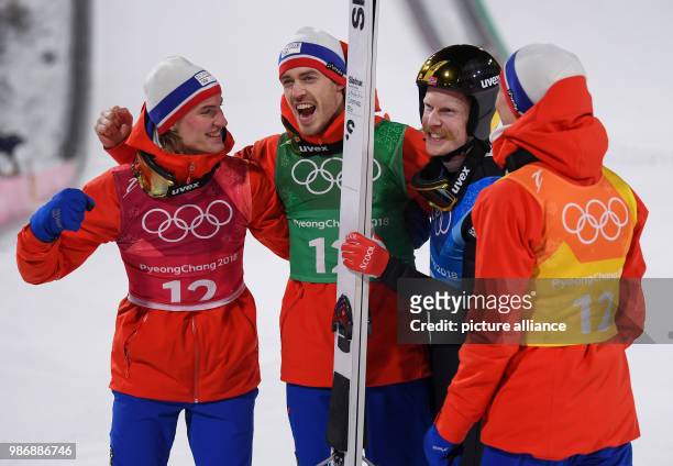 Norwegian gold medallists Daniel Andre Tande , Andreas Stjernen, Robert Johansson and Johann Andre Forfang celebrate after winning the men's large...