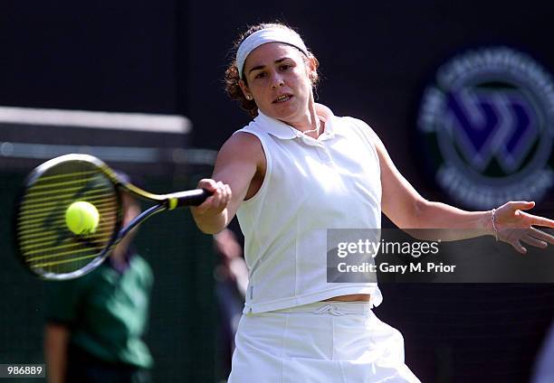 Virginia Ruano Pascual of Spain on her way to victory over number one seed Martina Hingis of Switzerland during the womens first round of The All...