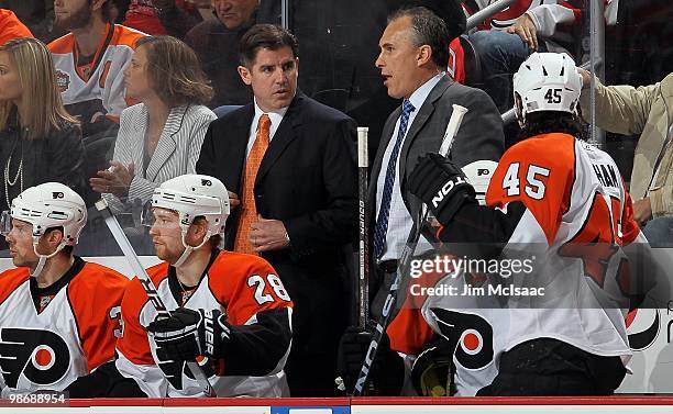 Head coach Peter Laviolette of the Philadelphia Flyers looks on from the bench against the New Jersey Devils in Game 5 of the Eastern Conference...