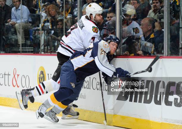 Brent Seabrook of the Chicago Blackhawks checks Patric Hornqvist of the Nashville Predators in Game Six of the Western Conference Quarterfinals...