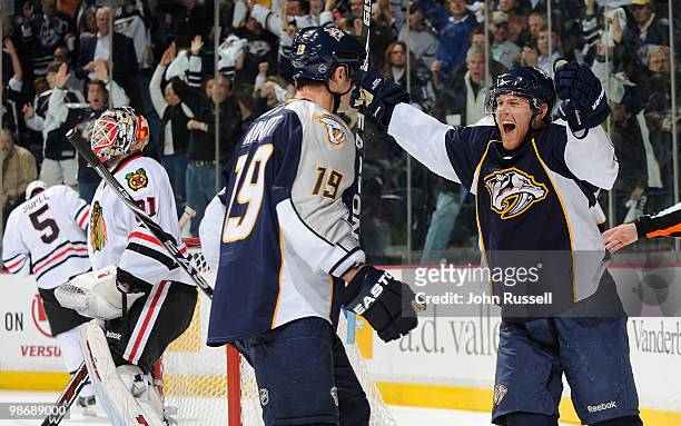 Patric Hornqvist celebrates a goal with Jason Arnott of the Nashville Predators against Antti Niemi of the Chicago Blackhawks in Game Six of the...