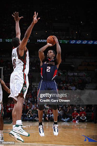 Joe Johnson of the Atlanta Hawks shoots a jumpshot against Kurt Thomas of the Milwaukee Bucks in Game Four of the Eastern Conference Quarterfinals...