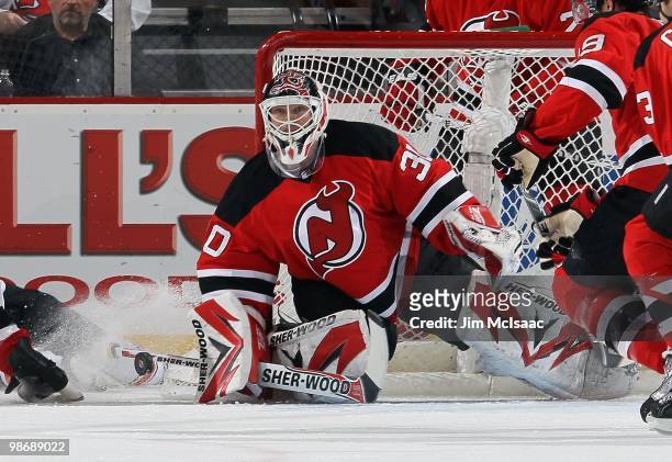 Martin Brodeur of the New Jersey Devils defends against the Philadelphia Flyers in Game 5 of the Eastern Conference Quarterfinals during the 2010 NHL...