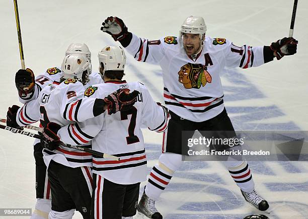 Patrick Sharp of the Chicago Blackhawks celebrates with his teammates after a goal was scored against the Nashville Predators in Game Six of the...