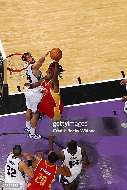 Jordan Hill of the Houston Rockets goes to the hoop against Omri Casspi of the Sacramento Kings at Arco Arena on April 12, 2010 in Sacramento,...