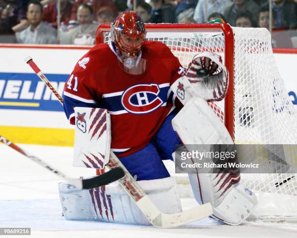Jaroslav Halak of the Montreal Canadiens makes a glove save on the puck in Game Six of the Eastern Conference Quarterfinals against the Washington...