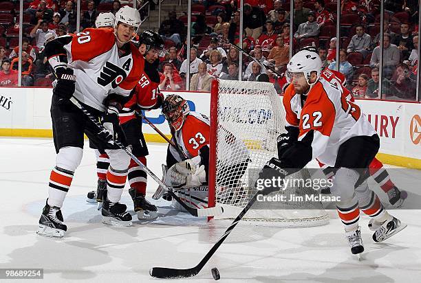 Ville Leino and Chris Pronger of the Philadelphia Flyers skate against the New Jersey Devils in Game 5 of the Eastern Conference Quarterfinals during...