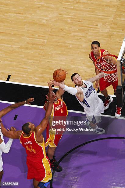 Andres Nocioni of the Sacramento Kings battles for a rebound with Luis Scola of the Houston Rockets at Arco Arena on April 12, 2010 in Sacramento,...