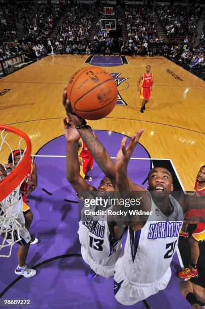 Tyreke Evans and Donte Greene of the Sacramento Kings battle for a rebound during the game against the Houston Rockets at Arco Arena on April 12,...