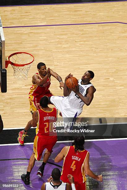 Tyreke Evans of the Sacramento Kings goes to the hoop against Jared Jeffries of the Houston Rockets at Arco Arena on April 12, 2010 in Sacramento,...
