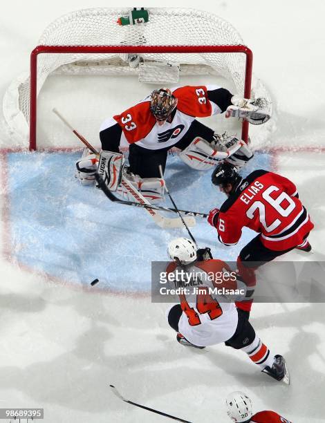 Brian Boucher and Kimmo Timonen of the Philadelphia Flyers defend against Patrik Elias of the New Jersey Devils in Game 5 of the Eastern Conference...