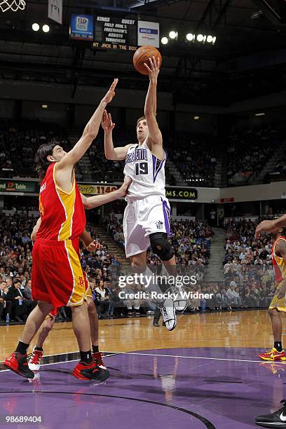 Omri Casspi of the Sacramento Kings hooks a shot over Luis Scola of the Houston Rockets at Arco Arena on April 12, 2010 in Sacramento, California....